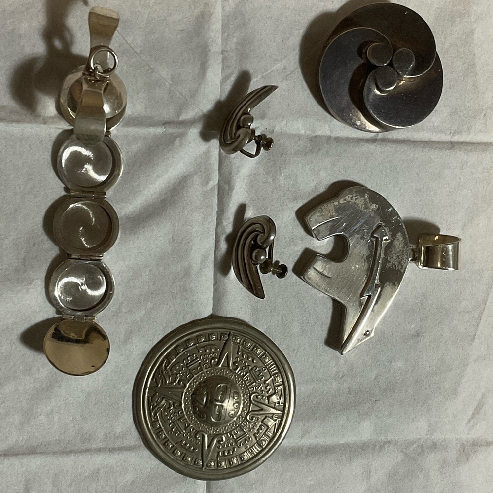 Sterling silver 2 brooches, 1 pair of earrings and 2 charms PLEASE SEE PICTURES
